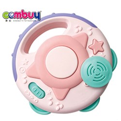 CB790276 - Baby pacifies hands to clap bells and drums
